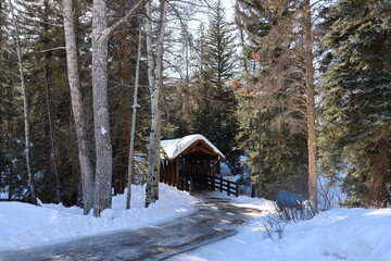 Snow covered wooden bridge near Vail, Colorado, USA.