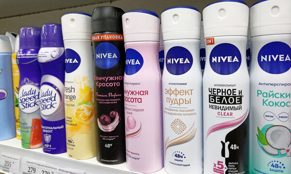 Variety of nivea and lady speed stick deodorant cans on store shelf