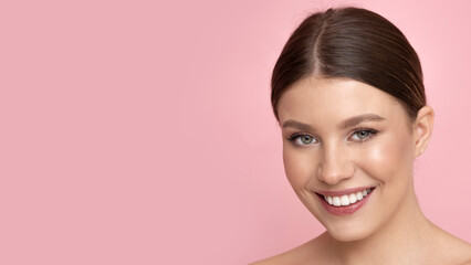 Fototapeta premium Beautiful young woman with perfect facial skin.