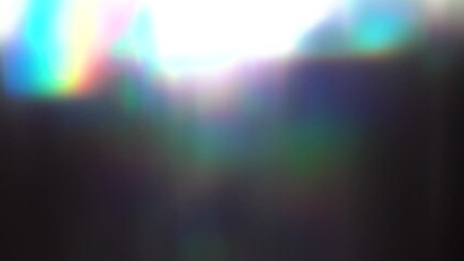 Light leaks and flares create a beautiful and colorful transition effect, dark background.