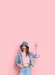 Beautiful young crazy girl on a pink background.