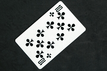 Ten of Clubs playing card, black background