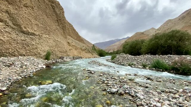 Shyok River near Rongdu Village and the Himalayan mountains of Nubra Valley in the morning, north of Leh, Ladakh, Jammu and Kashmir, India.