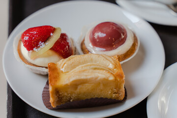 Baking. Cakes are on a white plate. General plan.