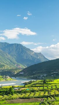 Time lapse of clouds moving over the rice paddies and the Punakha Valley in Bhutan.
