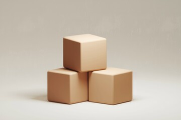 Obraz premium Three beige cubes stacked on a plain background.