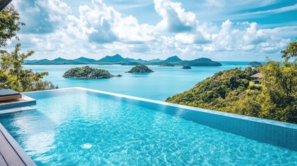 Fototapeta premium A serene pool overlooks the vast ocean and majestic mountains, creating a perfect blend of relaxation and natural beauty.