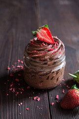 Chocolate mousse topped with fresh and freeze-dried strawberries