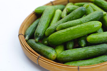 Mini cucumbers on white background.