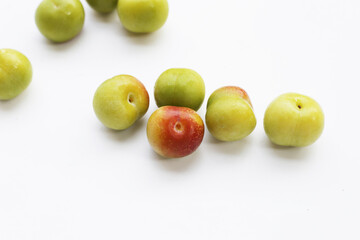Fresh green plum on white background