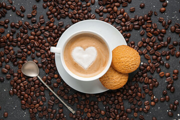 Cup of hot coffee with sweet cookies and beans on black background