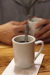 Hot cup of coffee on a table in a retro diner in Columbus, Ohio.