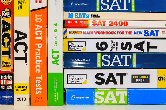 Stack of SAT books contain standardized practice tests for university admissions in USA.