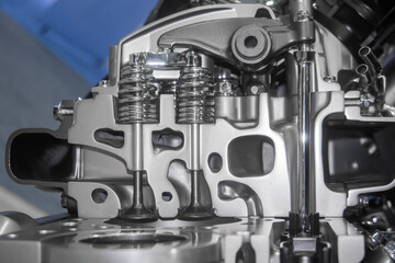 Close up view of new automotive engine with cut section showing inside details.
