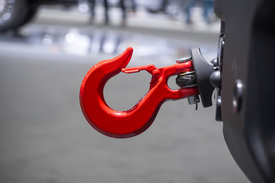 Close up view of red towing hook on a truck