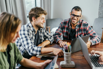 Group of young people working together. Creative business people in modern office