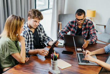 Group of young people working together. Creative business people in modern office