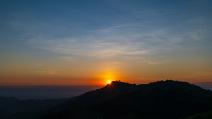 sunset sky on top of mountain and valleys. Natural landscape