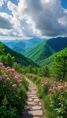 Scenic mountain path winds through green forest. Pink flowers line stone path in summer landscape. Vast mountains rise behind trail. Beautiful outdoor hiking scene. Perfect for vacation nature escape.