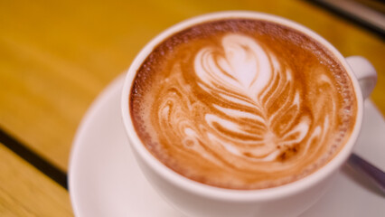close up photo of a late art of a beautiful coffee in the shape of a tulip