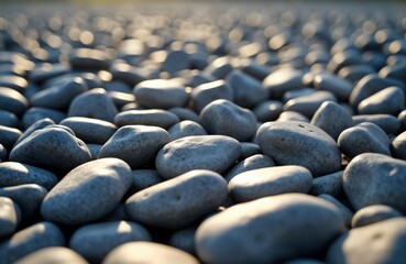 Obraz premium Close-up view of gray gravel stones. Natural light highlights rough texture. Ideal for landscaping projects background elements. Suitable for nature photography construction-related imagery. Shows