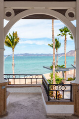 Sunny Beach Holiday Scene in La Paz, Baja California Sur - Mexican Beaches with Palm Trees, Malecon and Boardwalk, sunshine and beach buildings