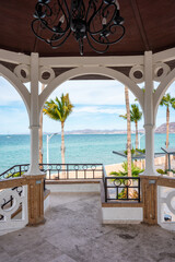 Sunny Beach Holiday Scene in La Paz, Baja California Sur - Mexican Beaches with Palm Trees, Malecon and Boardwalk, sunshine and beach buildings