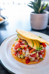 Tostada de Ceviche - Fresh fish hard shell taco in La Paz - Baja California Sur Mexico. Tasty and Colorful Mexican Street Food