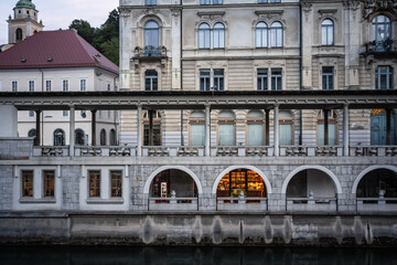 Selective blur on the arcades of the Ljubljana Central market at dusk or osrednja ljubljanska trznica, designed by Joze Plecnik, a landmark of Ljubljana, in Slovenia.