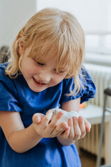 Pet hamster exploring in a cozy room with a child