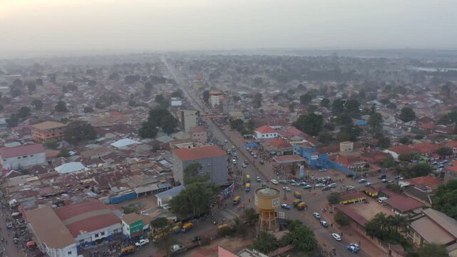 A Bustling Urban Scene With Vibrant Streets and Rooftops in Guinea-Bissau, West Africa - Aerial Drone Shot