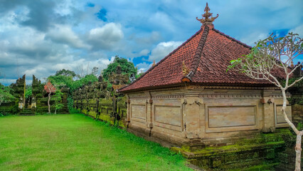 Hindu temple building and fence with blue sky background