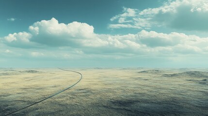 Fototapeta premium A long, winding road disappears into a vast, desolate desert landscape under a partly cloudy sky.