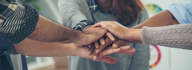 Team bump fist together Banner diversity solidarity teams multiethnic Partners hands together teamwork. Group of multiracial fist bump hands stack join hands together. Panorama Diversity people hands
