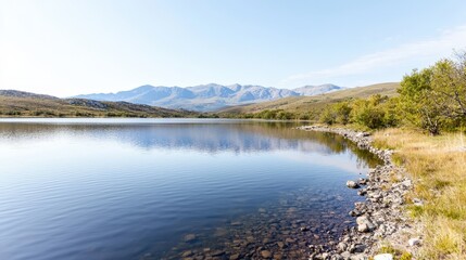 Obraz premium Majestic mountains reflecting in a calm lake.