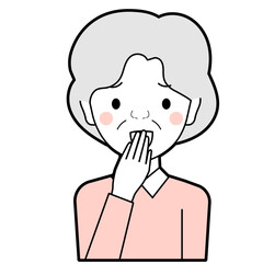 困った顔で笑うシニア女性