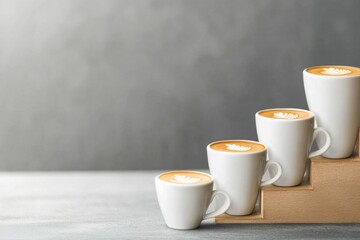Coffee Cup Bar Graph Illustration Showcasing Heights of Each Cup with Latte Art on Creamy Surface