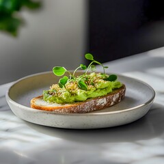 A plate with bread topped with mashed avocado, avocado paste, guacamole, microgreens, placed on a white plate