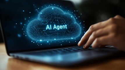An AI agent virtual cloud hologram and a laptop computer symbolizing agentic digital autonomy using teamwork and human collaboration in the autonomous workforce