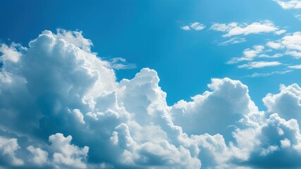 Naklejka premium Vibrant blue sky filled with fluffy cumulus clouds, conveying tranquility and natural beauty