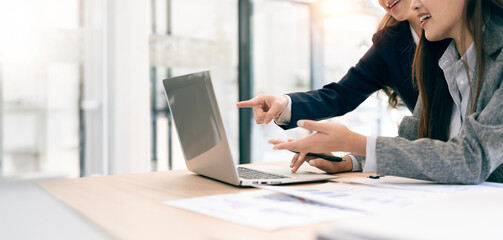 Fototapeta premium Business woman colleagues having a conversation and discussing project plan together at office.