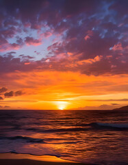 Fototapeta premium A fiery sunset paints the sky with vibrant hues as the sun dips below the horizon, casting its golden glow on the ocean waves
