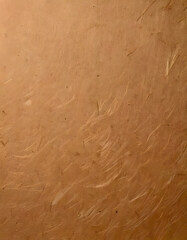 A textured surface in shades of brown with subtle fibers and specks creating a natural look