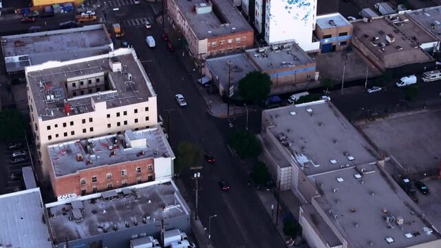 Aerial footage of the Skid Row neighborhood in Los Angeles city at sunset in California, USA