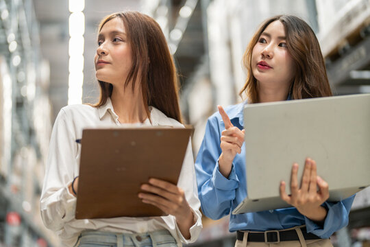 Female engineers team discussing inventory in warehouse logistics and supply chain planning, operation management, data analysis, warehouse shipping, inventory tracking, optimization and technology