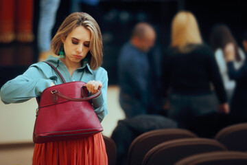 Forgetful Woman Checking her Purse at a Public Event. Lady with a messy, cluttered handbag losing...