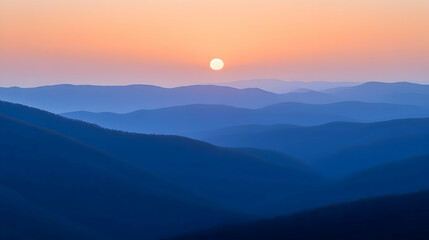 Sunset over layered blue mountains, peaceful scene, nature background, travel photography