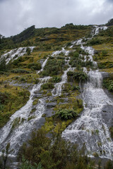 Extreme mountainous terrain, and waterfalls  on the Milford side of the Te Anau Milford road