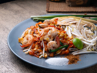 Pad Thai is a stir fry rice noodles with shrimp. Popular Thai street food.