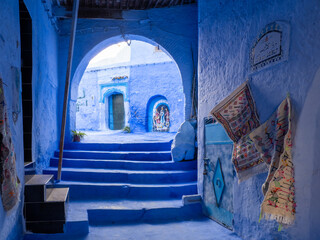 Chefchaouen,  the blue city in Morocco - doorways through an arch with steps